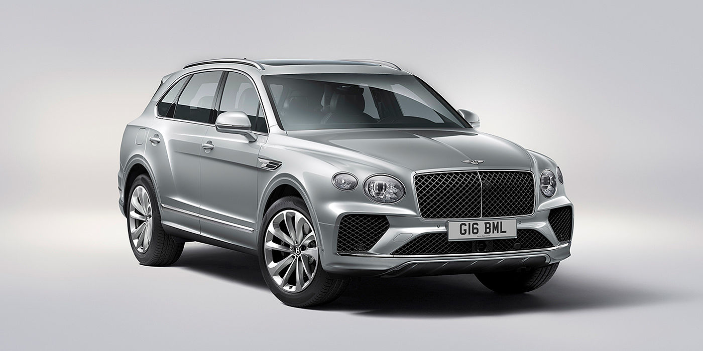 Bentley Riyadh Bentley Bentayga in Moonbeam paint, front three-quarter view, featuring a matrix grille and elliptical LED headlights.