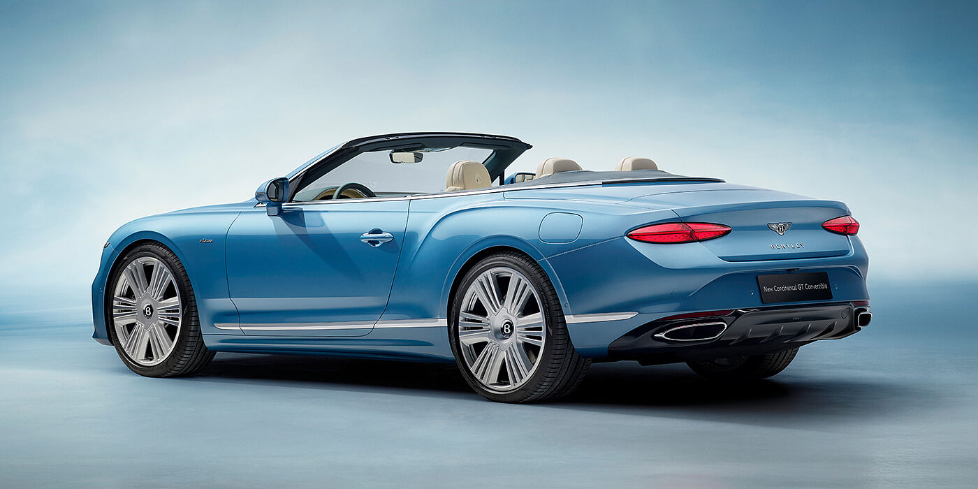 Bentley Riyadh New Bentley Continental GTC Azure convertible rear view in Light Windsor blue paint with 22 inch ten spoke wheels and chrome exterior details