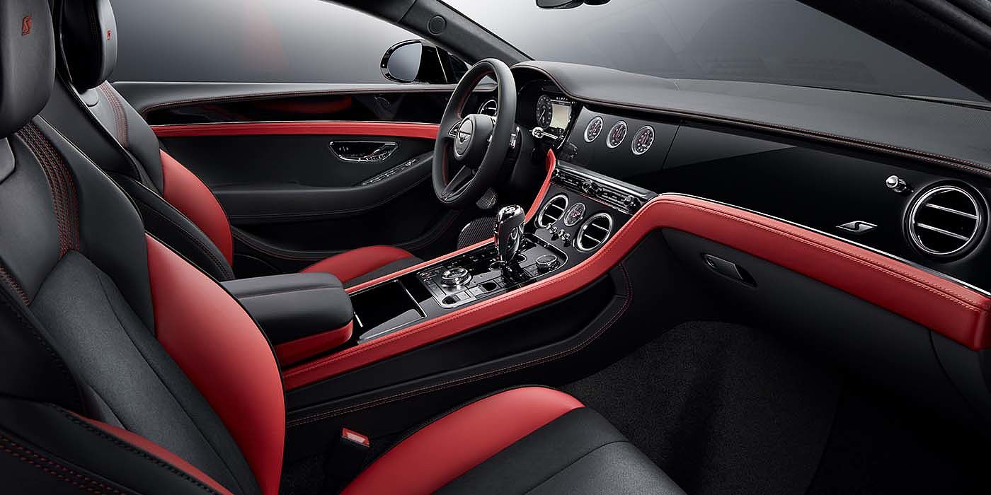 Bentley Riyadh Bentley Continental GT S coupe front interior in Beluga black and Hotspur red hide with high gloss Carbon Fibre veneer