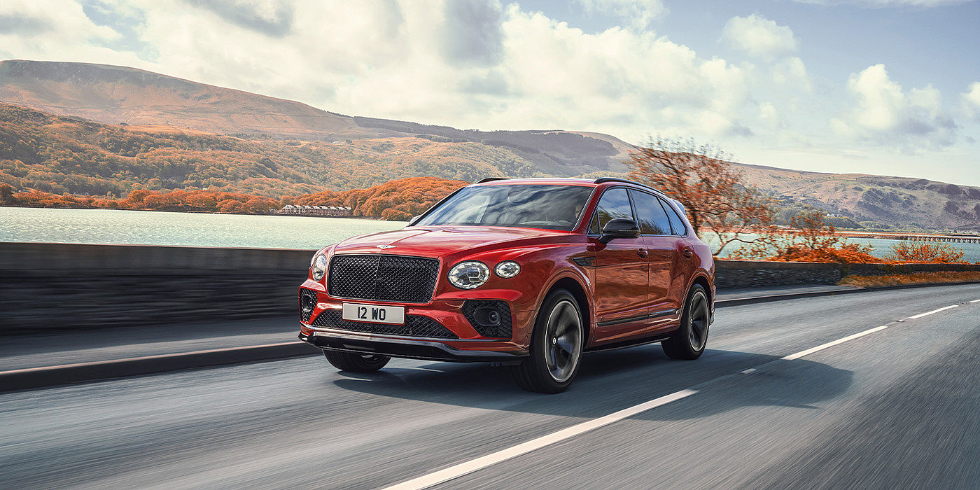 Bentley Riyadh Bentley Bentayga S SUV in Candy Red paint front 34 dynamic
