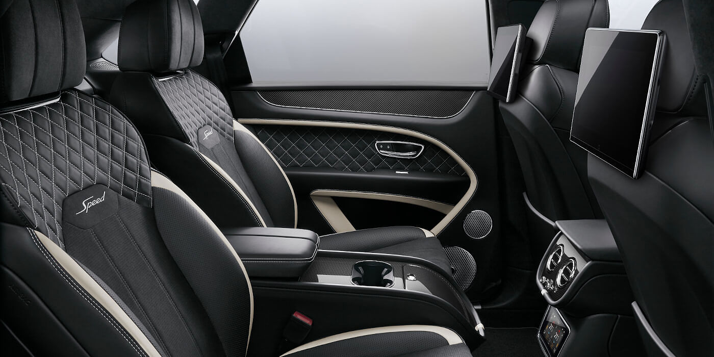 Bentley Riyadh Bentley Bentayga Speed SUV rear interior in Beluga black and Linen hide with carbon fibre veneer