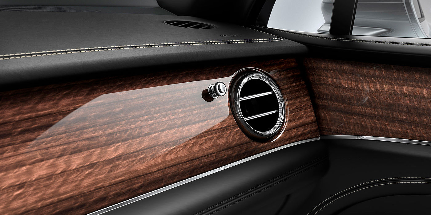 Bentley Riyadh Bentley Bentayga front interior Crown Cut Walnut veneer and chrome air vent.