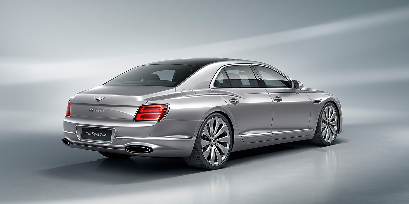 Bentley Riyadh New Bentley Flying Spur sedan rear view in Silverlake paint with ten spoke wheels and chrome matrix grille