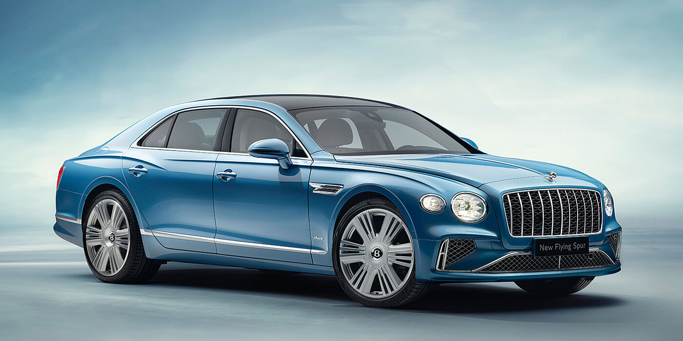 Bentley Riyadh New Bentley Flying Spur Azure sedan front view in Light windsor blue by Mulliner paint with 22 inch Azure wheels and chrome exterior details