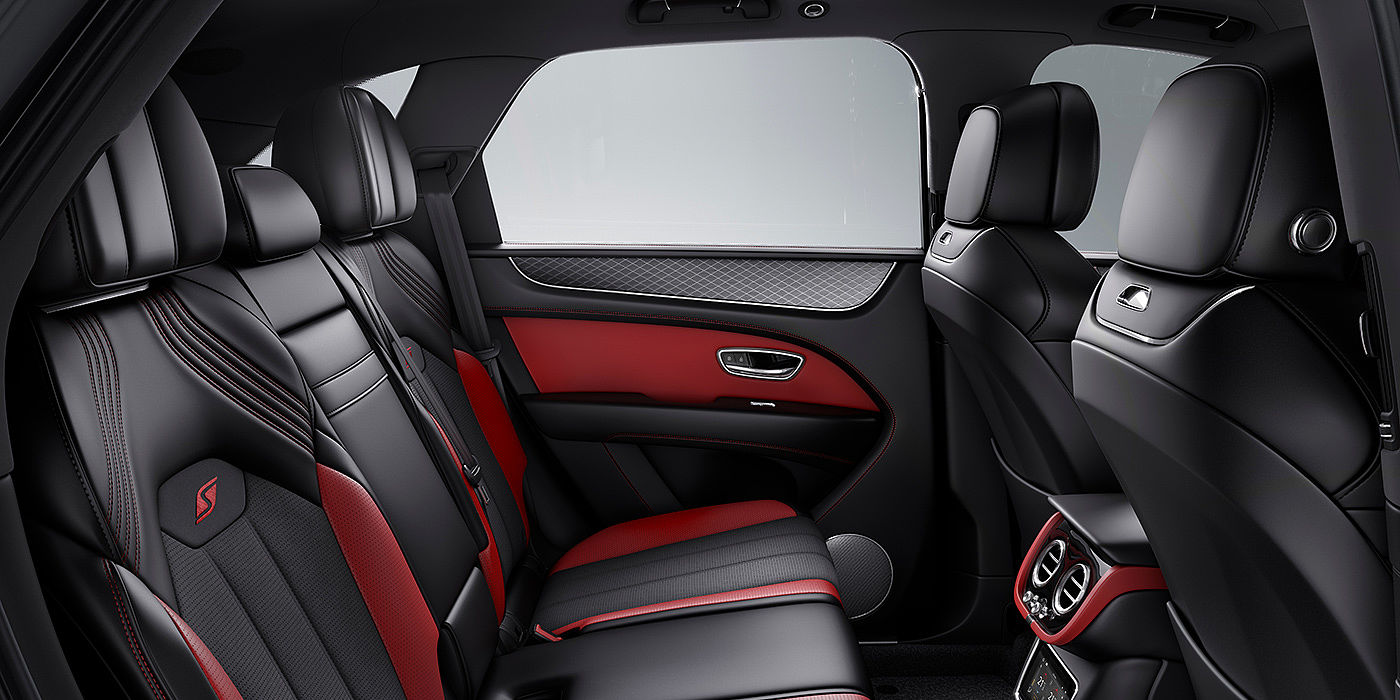 Bentley Riyadh Bentey Bentayga S interior view for rear passengers with Beluga black and Hotspur red coloured hide.