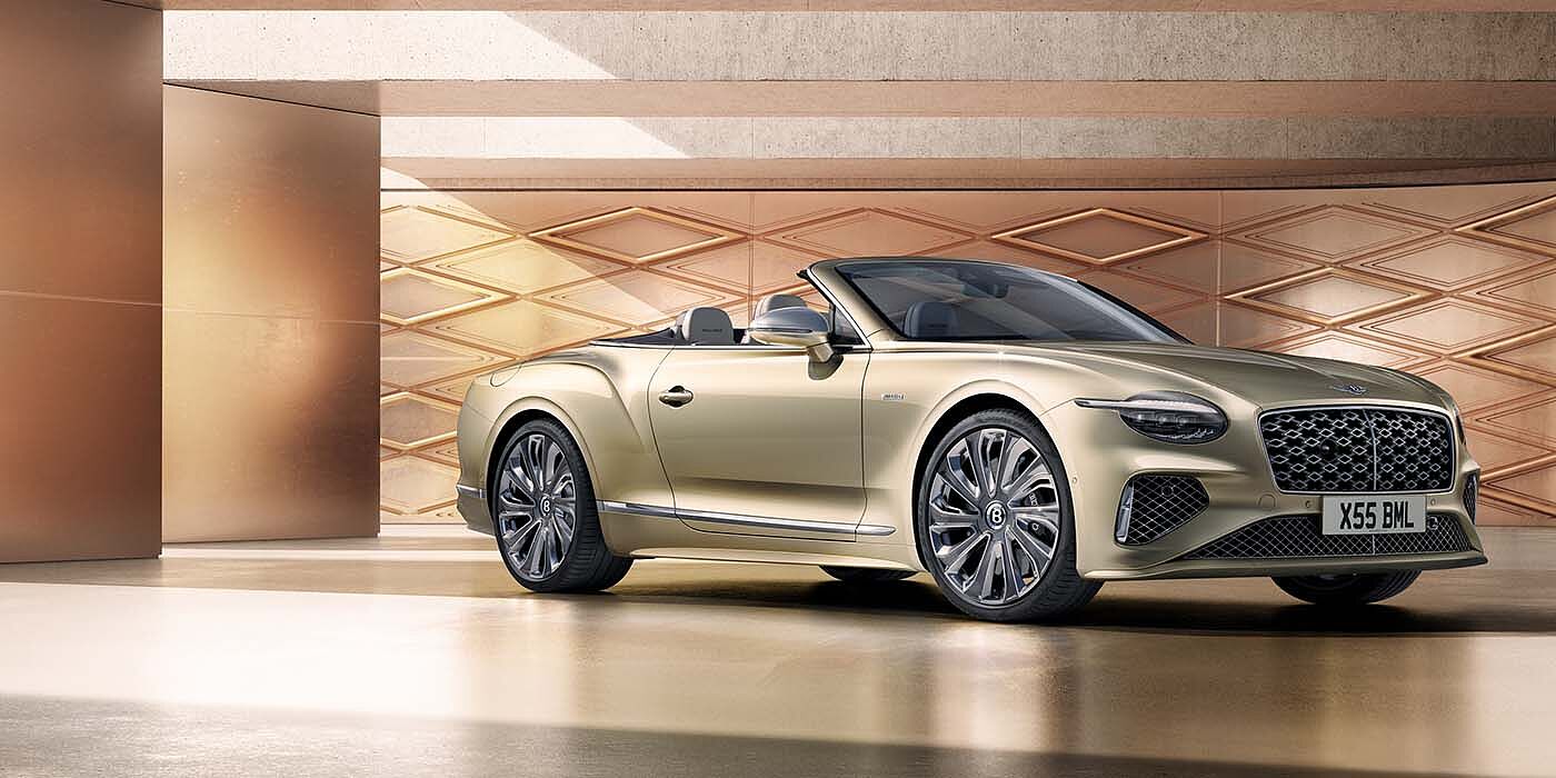 Bentley Riyadh Bentley New Continental GTC Mulliner V8 hybrid front three quarters in Patina paint