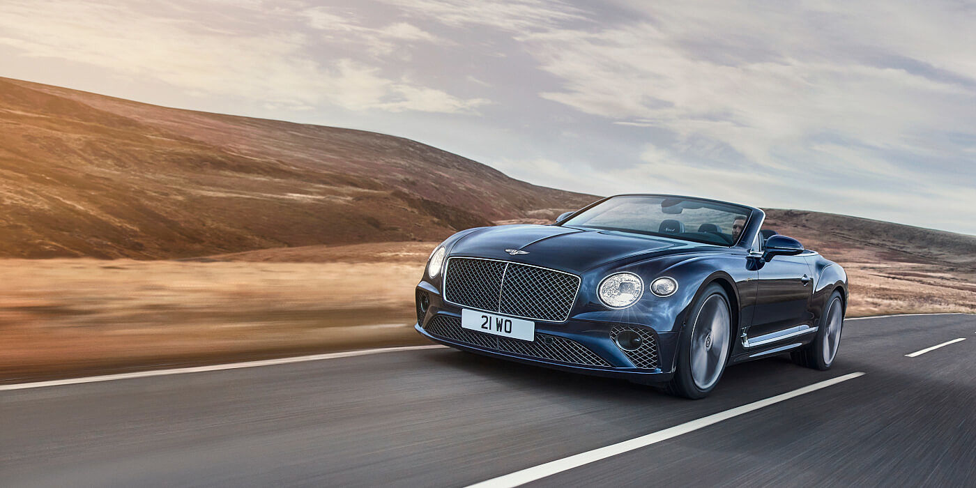 Bentley Riyadh Bentley Continental GTC Speed convertible in Peacock paint side front 34 dynamic