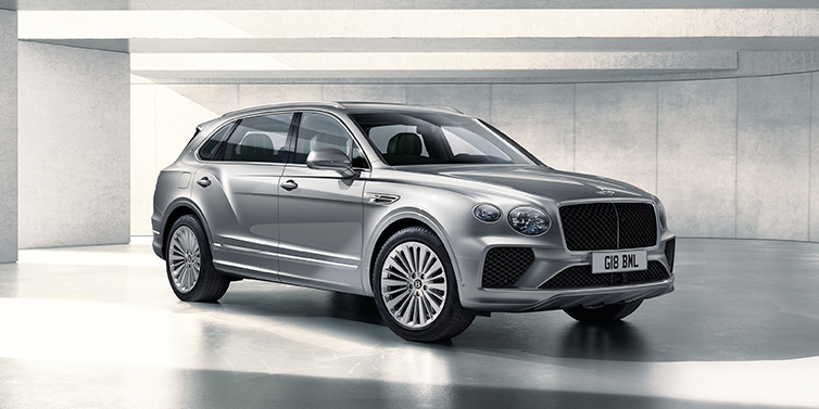 Bentley Riyadh Bentley Bentayga Extended Wheelbase SUV front three quarter in Moonbeam paint with a grey background