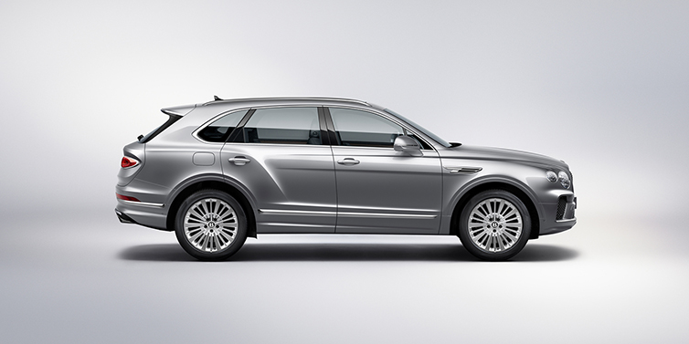 Bentley Riyadh Bentley Bentayga SUV side profile in Moonbeam silver paint against white background featuring 21 inch 5 spoke wheels