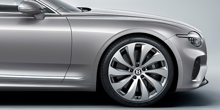Bentley Riyadh New Bentley Continental GT coupe side view featuring bonnet in Silverlake paint and 22 inch ten spoke silver painted and bright machined wheel