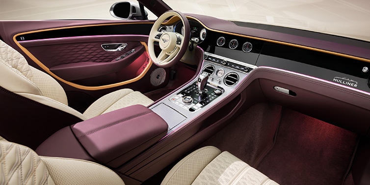 Bentley Riyadh Bentley Continental GTC Mulliner convertible front interior including Linen and Damson purple hides and Grand Black veneer