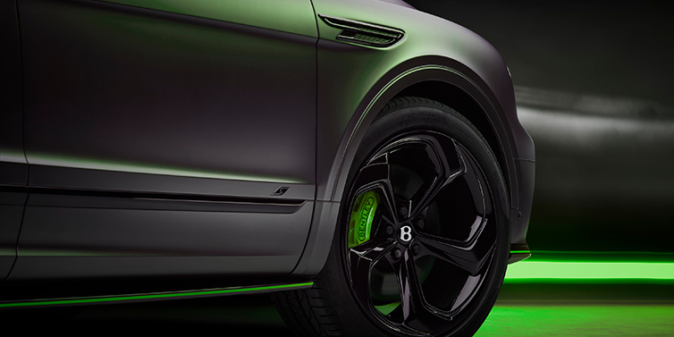 Bentley Riyadh Bentley Bentayga S Black Edition SUV exterior wheel detail with Cyber Green brakes with Anthracite Satin paint