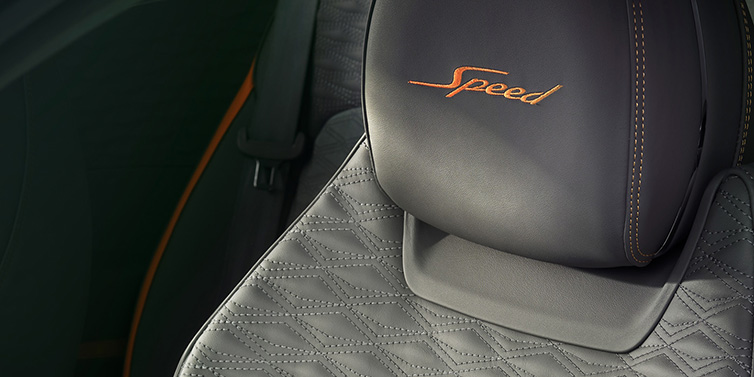 Bentley Riyadh Bentley Continental GT Speed coupe seat detail in Gravity Grey hide and Speed emblem in Mandarin by Mulliner coloured embroidery