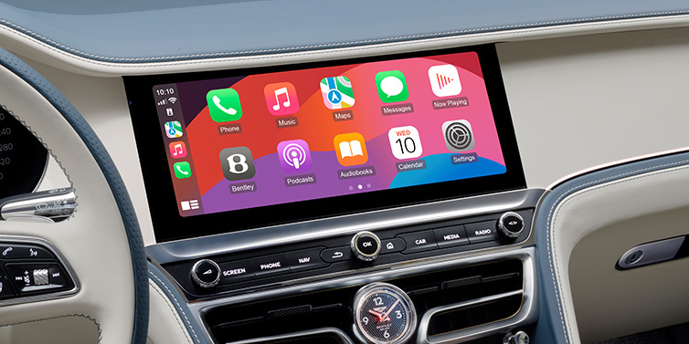 Bentley Riyadh New Bentley Flying Spur Azure sedan front cabin central MMI screen showing available services against Linen and Brunel hides and Piano Linen veneer