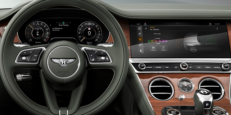 Bentley Riyadh New Bentley Continental GTC convertible front interior steering wheel view, with Beluga black leather and Crown Cut walnut veneer