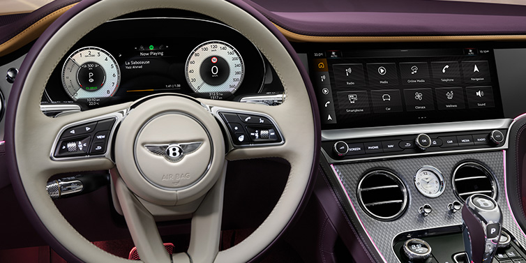 Bentley Riyadh Bentley Continental GTC Mulliner convertible steering wheel and drivers screens surrounded by Damson purple and Linen hides